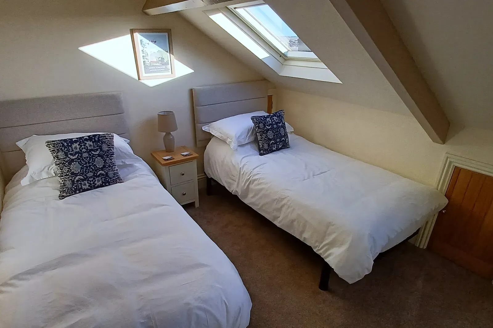 Top-floor twin bedroom with two single beds